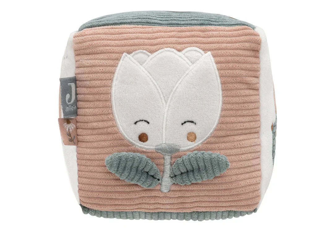 Vrolijke bloem op zijkant van activiteitenkubus, jollein