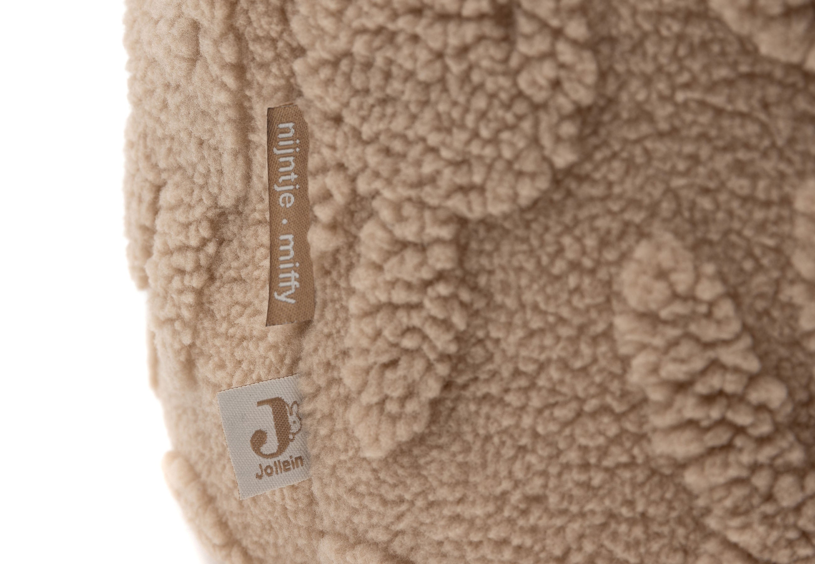 Detailopname van de zachte jacquard teddy stof met Miffy hoofdjes